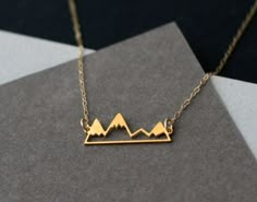 little golden mountain range necklace Golden Mountain, Gold Mountain, Favorite Necklace, Mountain Necklace, Bracelets Design, Body Chains, Mountain Range, Cute Jewelry, Snowboarding