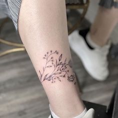 a woman with a tattoo on her leg