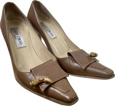 Vintage Jimmy Choo chestnut brown leather heels with a pointed toe and loafer style detailing that includes a horn toggle on each toe box. Made in Italy.Marked a size 35.5Ball of foot measures 3”Heel measures 3”In excellent vintage condition, very light and tiny scuffs but otherwise look pretty pristine Formal Brown Snip Toe Heels, Brown Formal Heels With Snip Toe, Loafer Style, Brown Leather Heels, Loafers Style, Chestnut Brown, Salvatore Ferragamo Flats, Leather Pumps, Chestnut