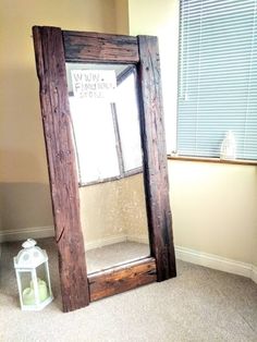 an old mirror sitting in the corner of a room