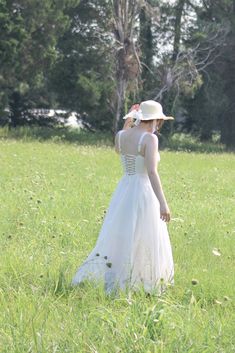 A must-have dress for spring and summertime, the Meadowlark midi features a vintage-style boned bodice with open, lace-up corset back, adjustable shoulder straps, a flowy tea-length skirt, and romantic sweetheart bustier neckline. A note on sizing- while this dress has an adjustable bust size due to the corset-style back, the waist is a single measurement and has no stretch, please choose your size accordingly! . Details: S: Bust: 32"-36", Waist 26" M: Bust 34"-38", Waist 28" L: Bust 36"-40", Wa Spring A-line Corset Dress With Fitted Bodice, Spring A-line Corset Dress With Corset Back, Lace Midi Dress For Prom In Summer, Spring Midi Dress With Lace-up Back For Prom, Summer Lace Dress With Corset Back, Summer A-line Corset Dress For Prom, Summer A-line Corset Dress For Garden Party, Elegant Dress With Adjustable Straps And Underbust Design, Elegant Underbust Dress With Adjustable Straps