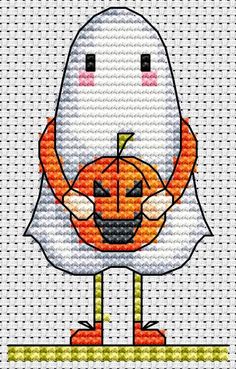 a cross stitch pattern with an image of a ghost holding a jack - o'- lantern