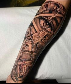 a man's arm with an all seeing eye and money tattoo on the forearm