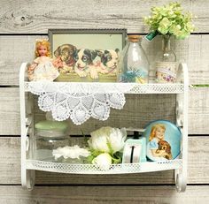 there is a shelf with pictures and other items on it