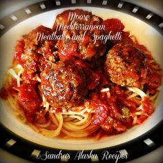 some meatballs and spaghetti on a plate