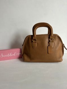 "Vintage Coach Baxter Satchel Soft and supple leather with brass hardware Roomy interior with one zip pocket, one slip pocket Secured by a top zipper Measures: 13\" L, 8\"H, 5 1/2\"W Made in the United States #069-9114 Flaws: Missing long strap, signs of wear shown in photos Cleaned, conditioned and ready to wear! Questions? Just ask More vtg coach styles/colors also available I3" Coach Vintage Handbags, Olive Green Top, Vintage Coach, Coach Leather, Givency Antigona Bag, Vintage Handbags, Vintage Bags, Kate Spade Top Handle Bag, Cloth Bags