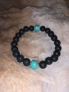 Oil defuser lava rock bracelet with turquoise beads Casual Stretch Bracelet With 8mm Lava Stone Beads, Casual Lava Stone Bracelet With Natural Stones, Casual Beaded Lava Stone Bracelets, Casual Hand-strung Lava Stone Beaded Bracelets, Casual Hand-strung Beaded Bracelets With Lava Stone, Casual Lava Stone Jewelry With 8mm Beads, Round Beads Bracelet With Natural Lava Stone, Casual Lava Stone Beaded Bracelets, Casual Beaded Lava Stone Jewelry