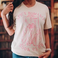 a woman wearing a t - shirt that says spicy romance book club