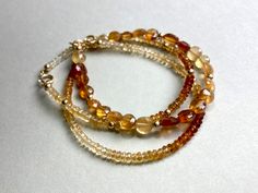 CITRINE GEMSTONE BRACELET IN GOLD FILLED  Gemstone bracelet with faceted Citrine and Gold filled Beads. The length of this bracelet is 17,5cm. If you need another length, please let me know. I send all my Jewelry packaged in a small Cotton Jewelry pouch. Please note that the appearance/coloring of the stones can vary as they are natural stones. MATERIAL faceted Citrine beads 3,5mm Gold filled beads and closing Length 17,5cm (you can write me a message, if you need another length) Adjustable Gold Beaded Citrine Bracelet, Adjustable Gold Citrine Bracelet, Gold Citrine Round Beaded Bracelets, Orange Stackable Jewelry With Round Beads, Orange Stackable Round Bead Jewelry, Gold Citrine Beaded Bracelets As Gift, Gold Citrine Beaded Bracelets With Round Beads, Gold Citrine Beaded Bracelet With Gemstone Beads, Gold Citrine Gemstone Beaded Bracelets