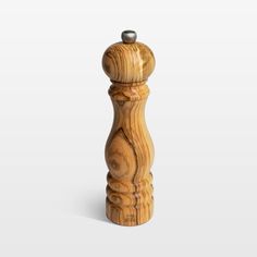 a wooden pepper mill on a white background