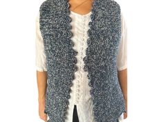 🧶 🧶 Handcrafted blue crochet vest 🧶 🧶 Add a pop of color and warmth to your wardrobe with our hand-knitted, vibrant vest. Crafted with care, each piece is a one-of-a-kind creation, made from soft, high-quality yarns that provide both comfort and style. Sustainably made, our vests are not just fashion-forward but eco-friendly too, offering timeless charm for any occasion. Embrace the beauty of handmade craftsmanship with a vest that's as unique as you are! Made from wool blend yarn. Productio Blue Knitted Sleeveless Vest, Fitted Blue Knitted Sweater Vest, Blue Sleeveless Knit Crochet Top, Blue Knitted Vest, Crochet Gilet, Vest Handmade, Handmade Vest, Blue Vest, Crochet Gift