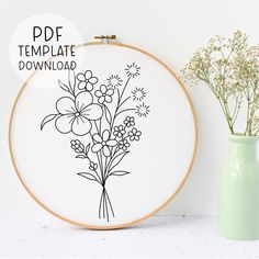 a vase with some flowers on it next to a cross stitch embroidery pattern that says, free template