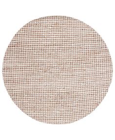 a round rug with brown and white dots on it, in the middle of a white background