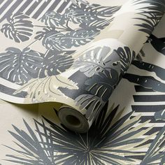 an image of a wallpaper with palm leaves on the side and black and white background