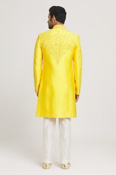 Yellow sherwani with floral tonal, dori embroidery and sequin highlights. Comes with cream pant. - Aza Fashions Transitional Designer Wear Yellow Sherwani, Yellow Fitted Bandhgala For Designer Wear, Yellow Designer Sherwani With Traditional Drape, Yellow Sherwani With Traditional Drape, Designer Yellow Sherwani With Pallu, Yellow Kurta For Eid Reception, Yellow Fitted Bandhgala For Wedding, Yellow Nehru Jacket With Zari Work For Wedding, Yellow Unstitched Suit With Naqshi For Wedding