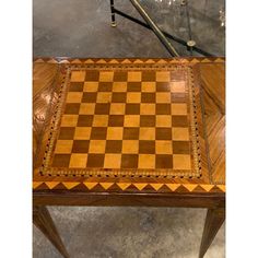 a wooden table with a chess board on it