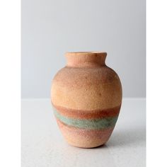 a small vase sitting on top of a table