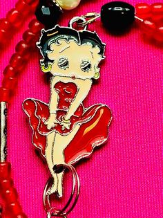 Vintage Betty Boop necklace , red and black beads Trendy Red Beaded Necklace, Trendy Red Beaded Necklaces, Trendy Red Round Bead Necklaces, Trendy Red Round Beads Necklace, Trendy Red Necklaces With Round Beads, Red Beaded Necklace For Party, Trendy Red Beaded Necklace For Party, Valentine's Day Red Beaded Necklaces, Trendy Red Handmade Beaded Necklaces