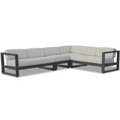 an outdoor sectional sofa with grey cushions