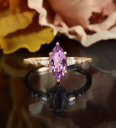 Marquise cut Amethyst engagement ring, rose gold wedding ring, pear shaped diamond moissanite ring, vintage seven stone anniversary ring ◆ Center Stone Stone: 5*10mm marquise cut amethyst ◆ Side Stone Stone: 2*3mm*2 pear shaped, 1.1mm*2, 1.5mm*2 round cut diamond / moissanite ◆ Dimension Band width: 1.4mm Band thickness: 1.2mm ◆ Ring Size Ring Size: Available in sizes 3 US to 9 US. However, if you need a smaller or larger size, please feel free to contact me. ◆ Gold Color Gold Color: 14K/18K Ros Luxury Marquise Birthstone Ring For Formal Occasions, Gold Amethyst Marquise Cut Ring For Anniversary, Elegant Marquise Amethyst Wedding Ring, Marquise Amethyst Ring In 14k Gold, Fine Jewelry Amethyst Ring, Marquise Cut, Luxury Marquise-cut Amethyst Ring, Amethyst Jewelry Ring, Wedding Ring Pear, Ring Pear Shaped