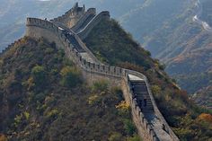 the great wall of china with people walking on it