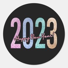 a happy new year round sticker with the number twenty three in multicolors