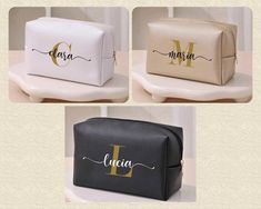 three monogrammed cosmetic bags with the letter m on each side and one in gold