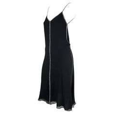 This rare black silk and crystal rhinestone Gucci slip dress was designed by Tom Ford for the Spring/Summer 1999. Natalie Portman wore a light blue variation to the premiere of "The Phantom Menace." Constructed of black silk this slip dress features a v-neckline, spaghetti straps, and a lightly flared hem. This chic little black dress is made complete with square rhinestone accents that line the straps, bust, sides, back and cascade down the front. Approximate measurements: Size - 38IT Bust: 28 Gucci Embellished Evening Dress, Gucci Silk V-neck Dress, Elegant Gucci Dress For Summer, Gucci Formal Summer Dresses, Gucci Summer Cocktail Dress, Summer Gucci Cocktail Dress, Gucci Summer Party Dress, Gucci Summer Dress For Night Out, Embellished Sleeveless Evening Slip Dress