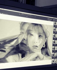 a black and white photo of a woman's face on a computer screen