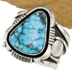 A CHOICE, handmade RING by Navajo Silversmith COOPER WILLIE. This OUTSTANDING Ring features a Natural ITHACA PEAK Turquoise stone with stunning Black Web matrix. Set into a decadent (AND HEAVY) sterling silver ring with astonishing, elaborate silver appliques. Signed. A Superior piece for your Native American jewelry Collection! Specifics & Measurements- Ring Measures- 1 1/8 inch tall (Wide shank is 12-18mm) Size- 13.5 Sterling Silver Weighs- 31 Grams! Stone- Natural ITHACA PEAK Turquoise Signed- by Navajo Silversmith- COOPER WILLIE Ring- Traditional Revival Marked $850.00 (But on Sale Now) SIZING- Your Local Jeweler should be able to size a sterling band, but I am not personally able to do so. Thank you. MENS Navajo Turquoise Ring ITHACA PEAK Sterling Silver COOPER WILLIE 13.5 HEAVY MENS Navajo Turquoise, Men's Jewelry Rings, American Jewelry, Native American Jewelry, Turquoise Stone, Handmade Ring, Size 13, Turquoise Ring, Native American