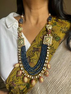 SHIVKA Special. Be Classy, Be Beautiful!! The gorgeous fusion necklace and exclusive earrings are beautifully handcrafted by our skilled Indian craftsmen from Jaipur in gold polish. Material: Blue Sapphire, Kundan, The length of the earrings is 7 cm The drop length of the necklace is 11 inches Necklace comes with hook closure. Notice the Tanjore artwork on cherry quartz beads, Enamelled work on side brooches Exclusive Earrings, Drops Necklace, Be Classy, Cherry Quartz, Jewellery Accessories, Quartz Beads, Kundan Jewellery, Earrings Statement, Gold Polish