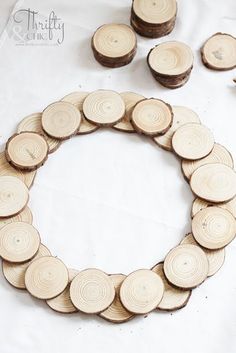 several pieces of wood are arranged in the shape of a circle on a white surface