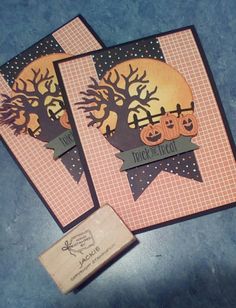 two handmade halloween cards with pumpkins on them and a rubber stamp that says happy halloween