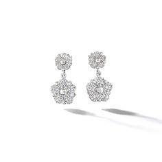 Handcrafted pair of platinum diamond drop earrings featuring ten round brilliant cut diamonds set in Anzia Collection's floral motif. Formal Flower-shaped Diamond Earrings With Single Cut Diamonds, Formal Diamond Cluster Earrings With Sparkling Stones, Formal Flower-shaped Diamond Earrings With Accents, Formal Flower Shaped Diamond Earrings With Accents, Formal Diamond Earrings With Flower Shape, Diamond Flower Shaped Earrings For Formal Events, Diamond Flower Shaped Earrings For Formal Occasions, Formal Bridal Earrings With Cubic Zirconia In Flower Shape, Luxury Cubic Zirconia Flower Earrings For Formal Occasions