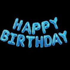 the words happy birthday are lit up in bright blue neon letters on a black background