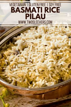 a bowl filled with rice sitting on top of a table