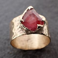 Partially Faceted Ruby Sapphire / Cigar Band / Cocktail / Statement ring I created this setting in wax then cast it in recycled 14k gold at my home studio. This lovely Sapphire ring is a size 7. The stone measures about 9.5mm X 7.5mm. The band is around 10mm wide. Throughout all time and history in every tribe and culture all around the world crystals, minerals and gemstones have used for healing, luck, divination, adornment vibrational medicine and so much more. Sapphire is a stone for mental c Unique Untreated Yellow Gold Jewelry, Unique Untreated 14k Gold Jewelry, Hand Forged Ruby Ring For Anniversary, Untreated Open Ring Jewelry For Anniversary, Untreated Fine Jewelry For Anniversary, Untreated Recycled Gold Jewelry As A Gift, Unique 14k Gold Ruby Ring For Anniversary, Recycled Gold Untreated Jewelry As A Gift, Untreated Recycled Gold Jewelry Gift