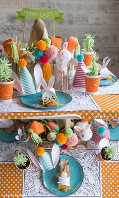 an easter table setting with bunny decorations