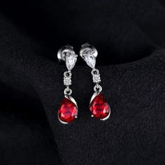 1.9ct Pear Created Red Ruby 925 Sterling Silver Drop Earrings Gemstone Jewelry Specifications - Style: Dangle Drop Stud Earrings - Gem Color: Red - Gem Cut: Water Drop - Material: Solid 925 Sterling Silver - Metal Stamp: S925 - Item Weight: 2.1g - Main Stone: Ruby High-Quality Materials Crafted from solid S925 sterling silver, these small water drop earrings boast strength and shine. They are tarnish-resistant and hypoallergenic, ensuring comfort without irritation. Fit for Any Occasion Enhance New Fashion Earrings, Sterling Silver Drop Earrings, Tiny Stud Earrings, Ruby Earrings, Ruby Stone, Sterling Silver Dangle Earrings, 925 Silver Earrings, Red Ruby, Silver Gifts