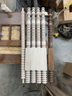 several different types of electrical wires on top of wooden pallets in a workshop area