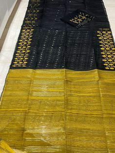 Beautiful bright yellow and black combinations authentic Handloom Bangladeshi Dhakai !  Super elegant & super comfortable! Saree name : Dhakai Jamdani  Material: silk / cotton  Blouse Piece - Yes  Fall and Edging complimentary . Disclaimer : The color of actual product may vary slightly from the images provided due to photographic lighting conditions and difference in screen resolutions. Fall and pico complimentary . Please leave your phone number and Email id for shipping purpose . Black Cotton Silk Dupatta With Cutdana, Black Handloom Traditional Wear For Puja, Black Cotton Dupatta With Woven Motifs, Festive Black Cotton Silk Traditional Wear, Black Cotton Dupatta With Cutdana, Black Cotton Dupatta With Traditional Patterns, Black Cotton Traditional Wear With Pallu, Black Cotton Saree With Traditional Patterns, Black Cotton Silk Dupatta With Self Design