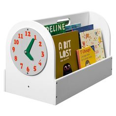 a white clock with books in it