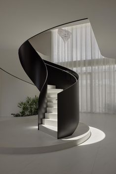 a spiral staircase in the middle of a room