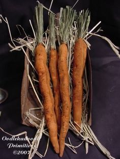 there are three carrots that have been picked from the ground and placed on top of each other