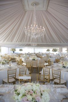 the tables are set with white and gold linens for an elegant wedding breakfasteon