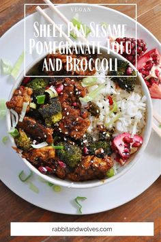 a white plate topped with meat and broccoli next to rice on a wooden table