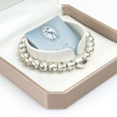 "All matte silver balls are carefully engraved with the three letters of the Tibetan Om Ah Hum. Each engraved letter is designed in a beautiful font in HEENAL. I am proud of the luxurious quality. This bracelet is perfect for wearing alone or layered with others.  It is made of high quality 8mm silver balls and one 12mm silver ball guru bead.  Made with elastic stretch transparent cord for a perfect fit so please select size from the drop-down menu. 13.5 cm (5.3 inch)   (12mm:1 / 8mm:20) 14.3 cm Luxury Sterling Silver Spiritual Bracelet, Luxury Spiritual Silver Beaded Bracelets, Om Ah Hum, Tibetan Meditation, Buddhist Prayer, Meditation Bracelet, Prayer Bracelet, Yoga Bracelet, Mala Bracelet