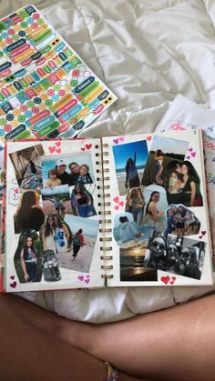 an open photo book with pictures of people and hearts on it, in someone's lap