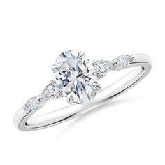 a white gold engagement ring with diamonds on it