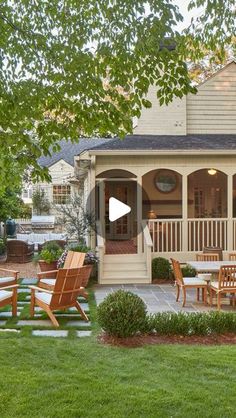 a patio with chairs and tables in front of a house